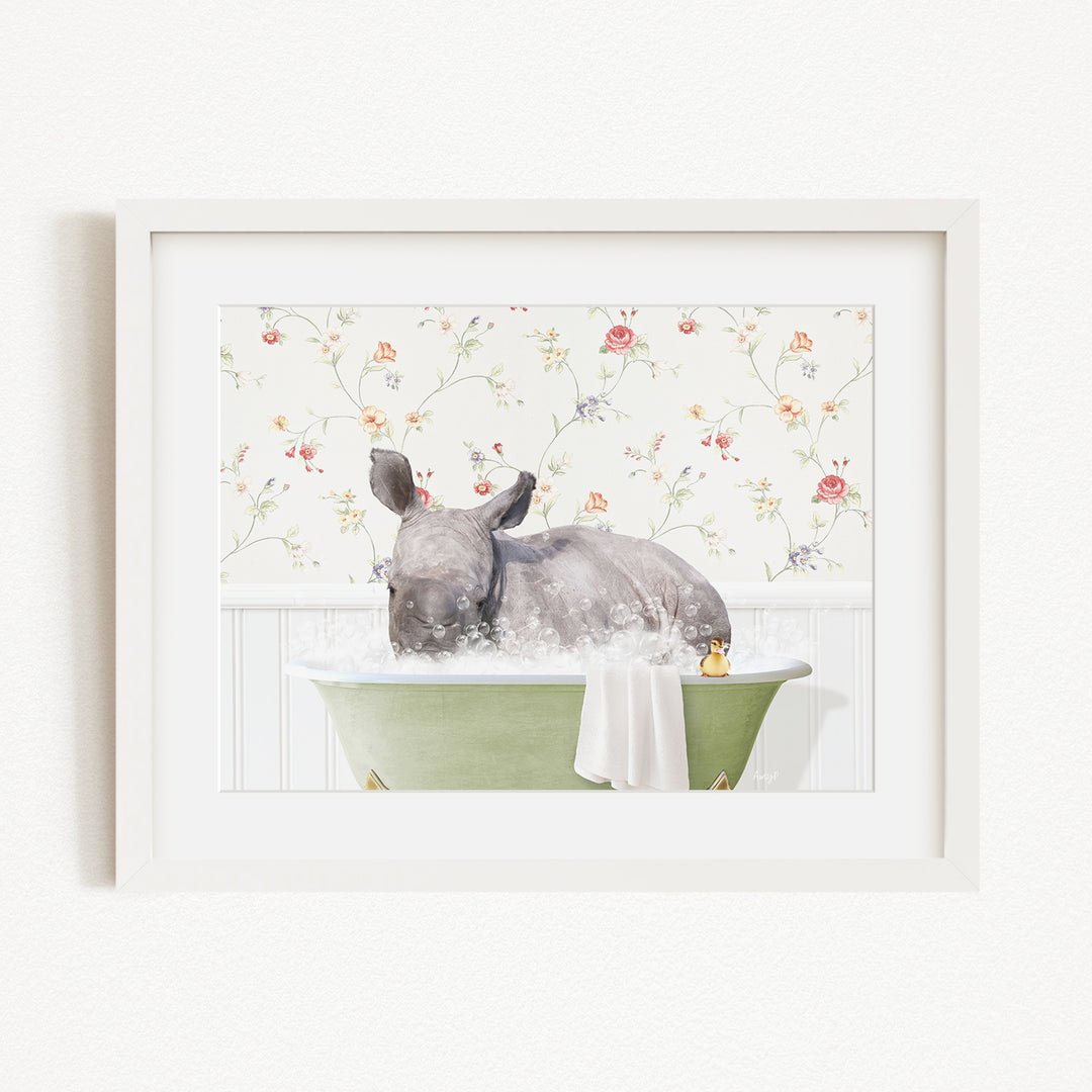 A rhinoceros is sitting in a green bathtub filled with water, surrounded by a floral patterned wall.