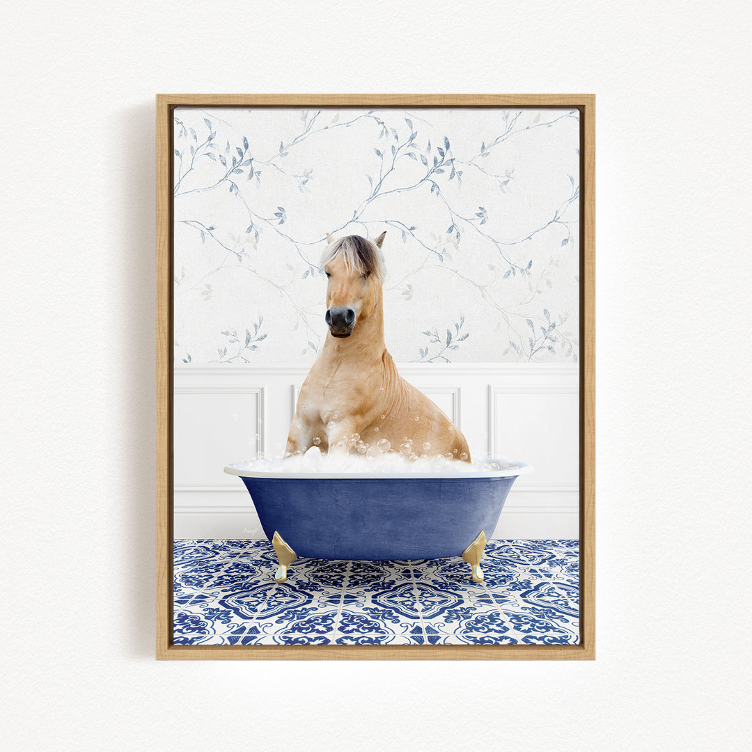 A horse sitting in a blue bathtub filled with bubbles, surrounded by a blue and white patterned rug.