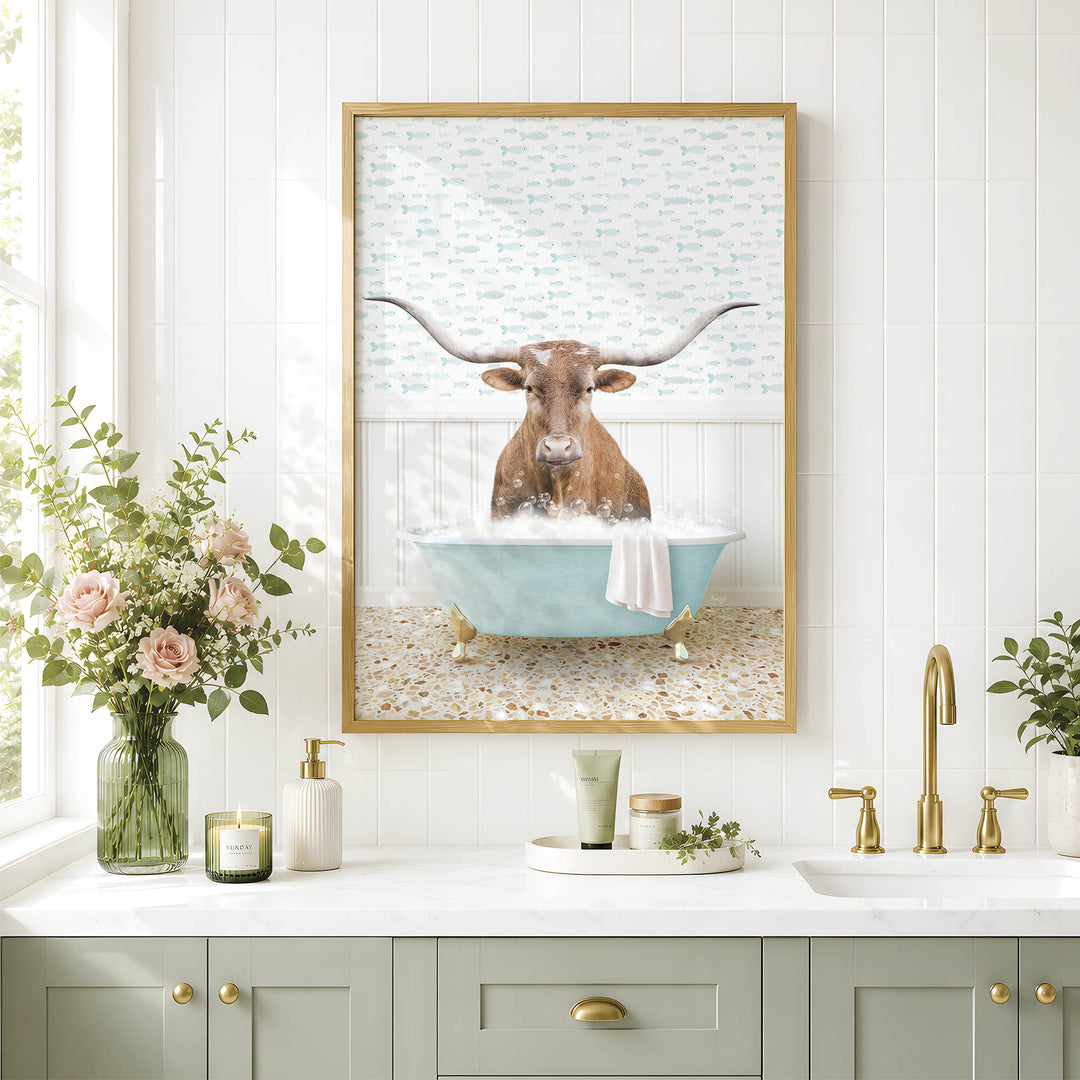 a framed picture of a bull with long horns sitting in a bathtub, surrounded by flowers and a vase.