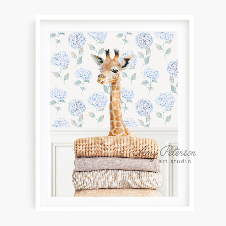 a giraffe standing on top of a pile of blankets