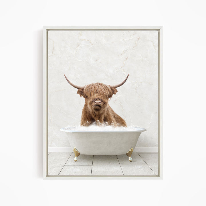 A brown Highland cow with long horns is sitting in a white bathtub filled with water, creating a whimsical and playful scene.