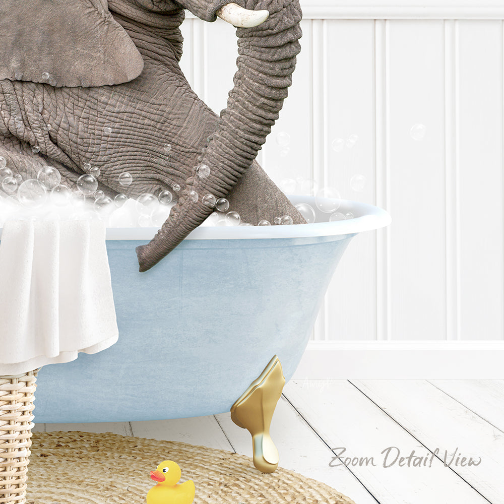 A large elephant is sitting in a blue bathtub filled with bubbles, surrounded by a yellow rubber duck and a white towel.