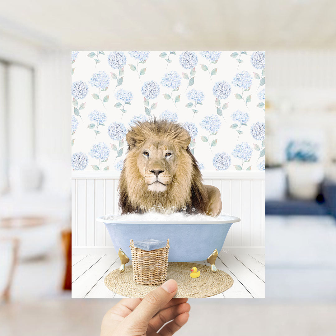 A lion is sitting in a blue bathtub filled with water, surrounded by a floral patterned wall and a yellow rubber duck.