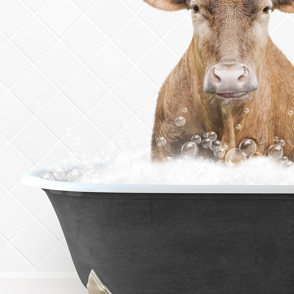 a cow is sitting in a bathtub with bubbles