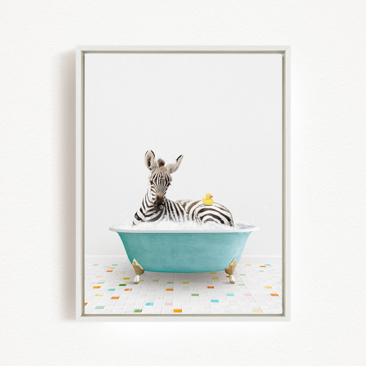 A zebra is sitting in a blue bathtub filled with water, with a rubber duck floating on its back.