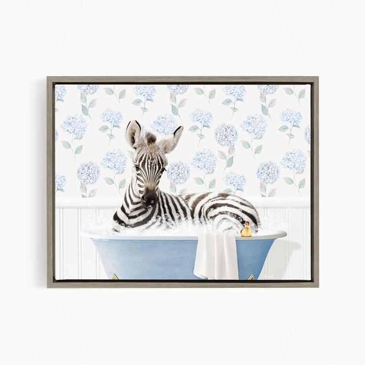 A zebra is sitting in a blue bathtub filled with water, surrounded by a floral pattern on the wall behind it.