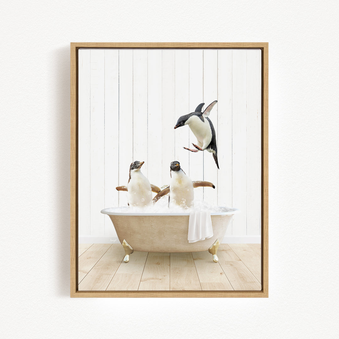 A framed image depicting two penguins sitting in a bathtub, with one penguin flying above the other.