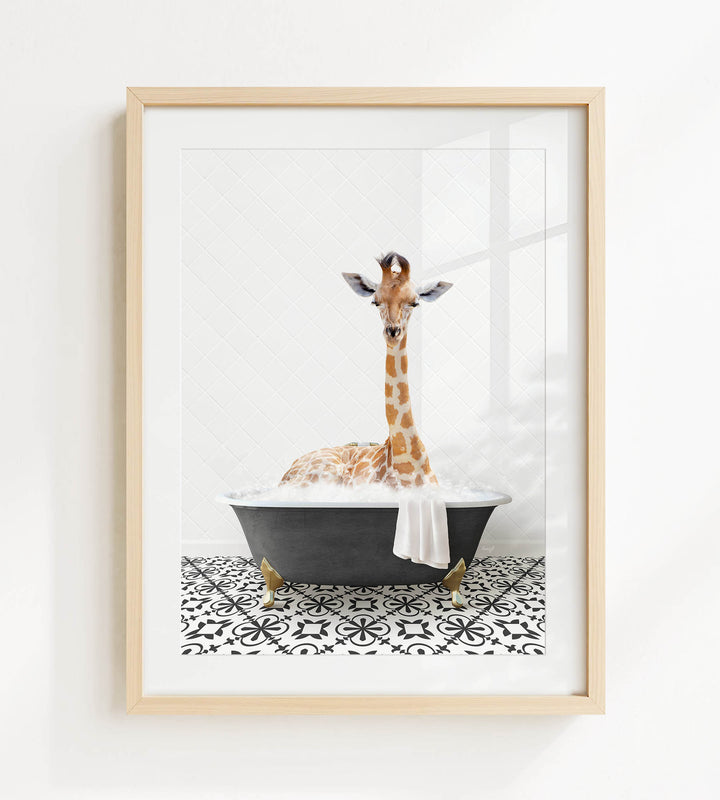A giraffe is sitting in a black bathtub filled with bubbles, creating a whimsical and playful scene.