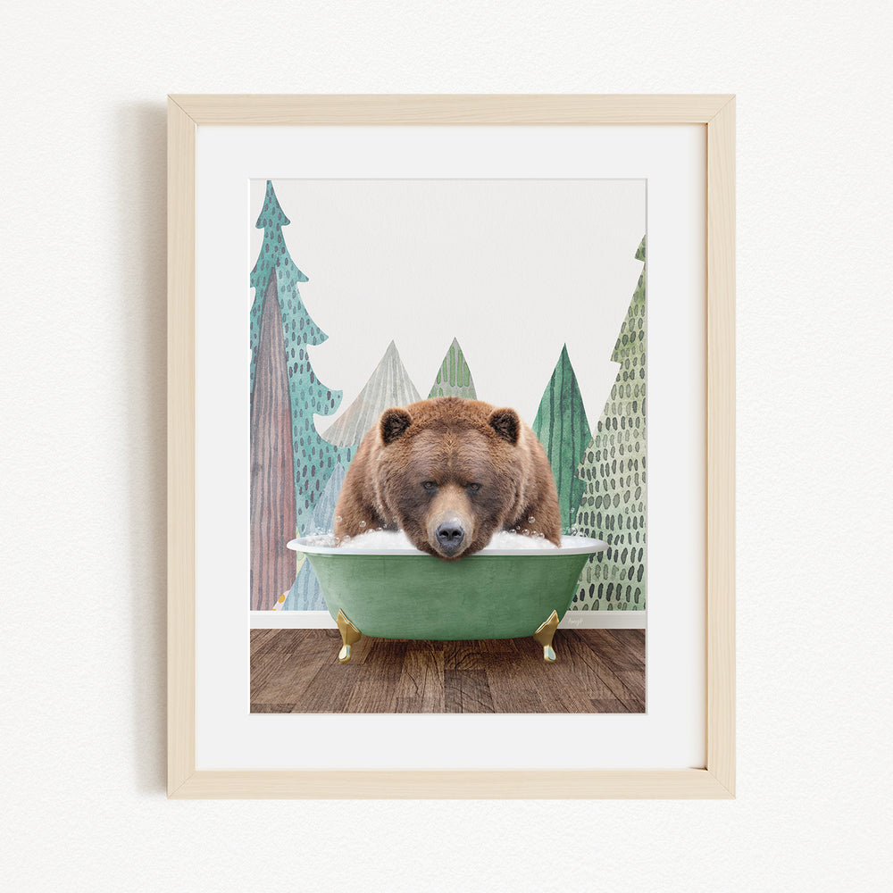 A brown bear is sitting in a green bathtub, surrounded by a forest scene with trees and a white background.