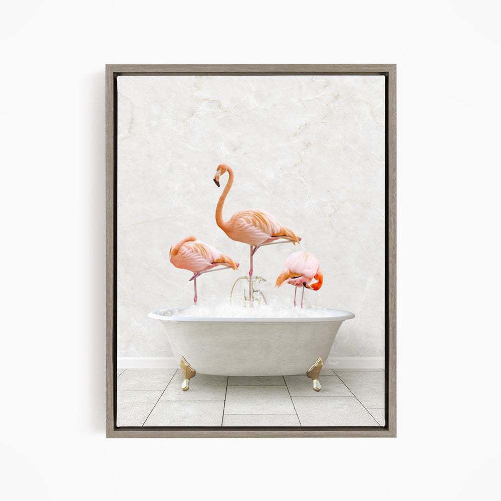 A framed image depicting three pink flamingos standing in a white bathtub filled with water.