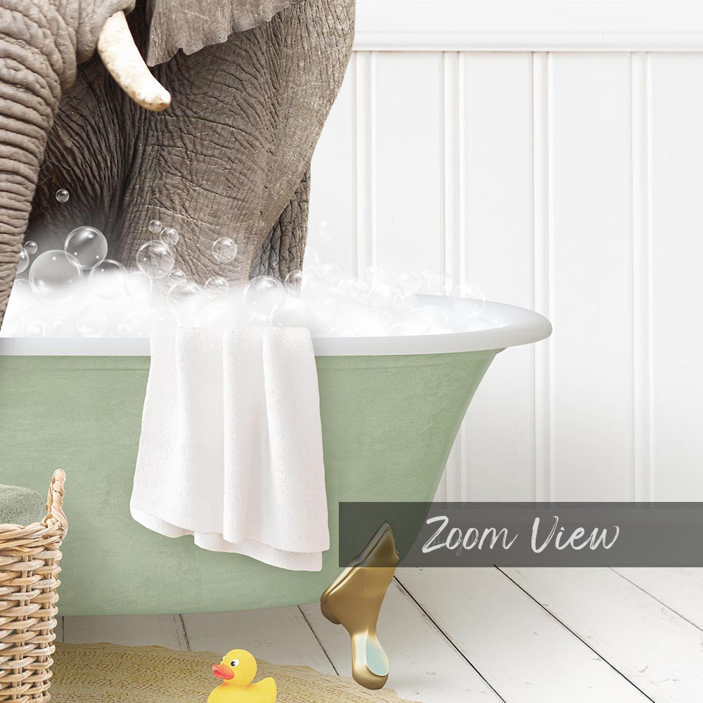 A green clawfoot bathtub filled with bubbles, with a towel hanging on the side and a rubber duck nearby.