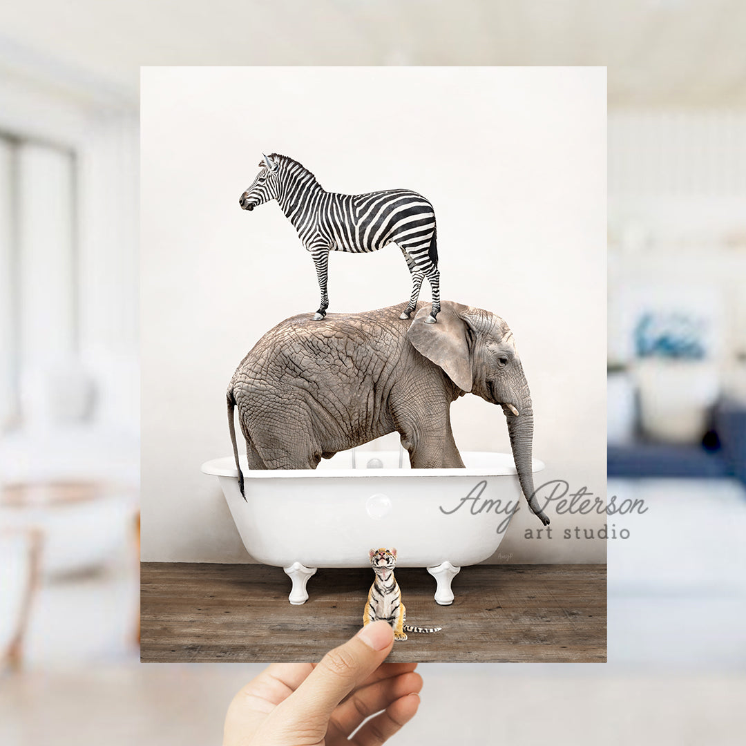 a zebra and a zebra standing on top of an elephant in a bathtub