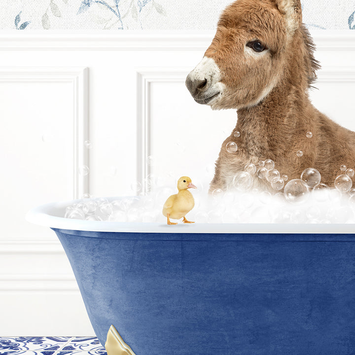 a donkey in a bathtub with bubbles and a rubber duck