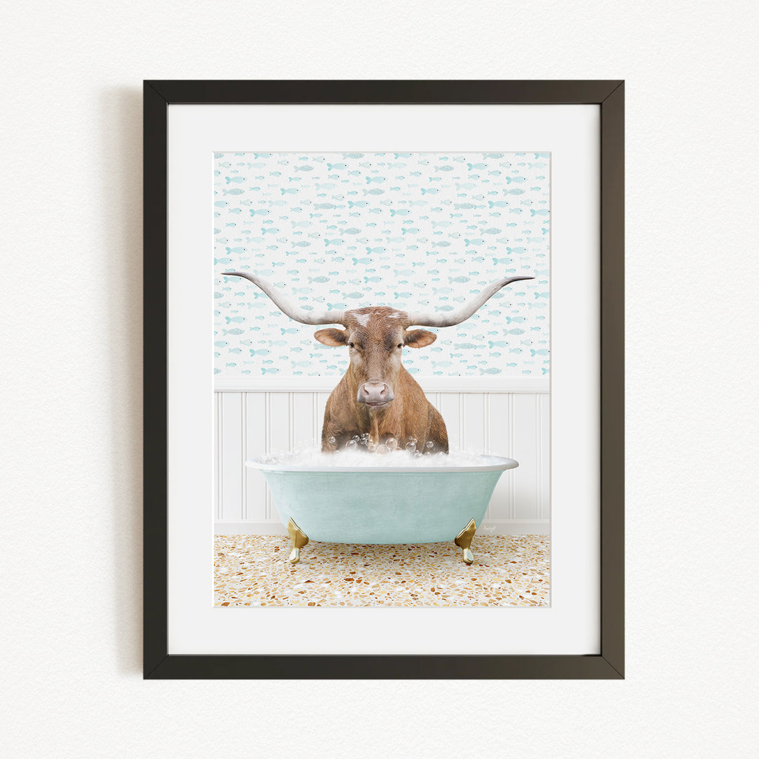 A brown cow with large horns is sitting in a light blue bathtub filled with water, surrounded by a patterned wall.