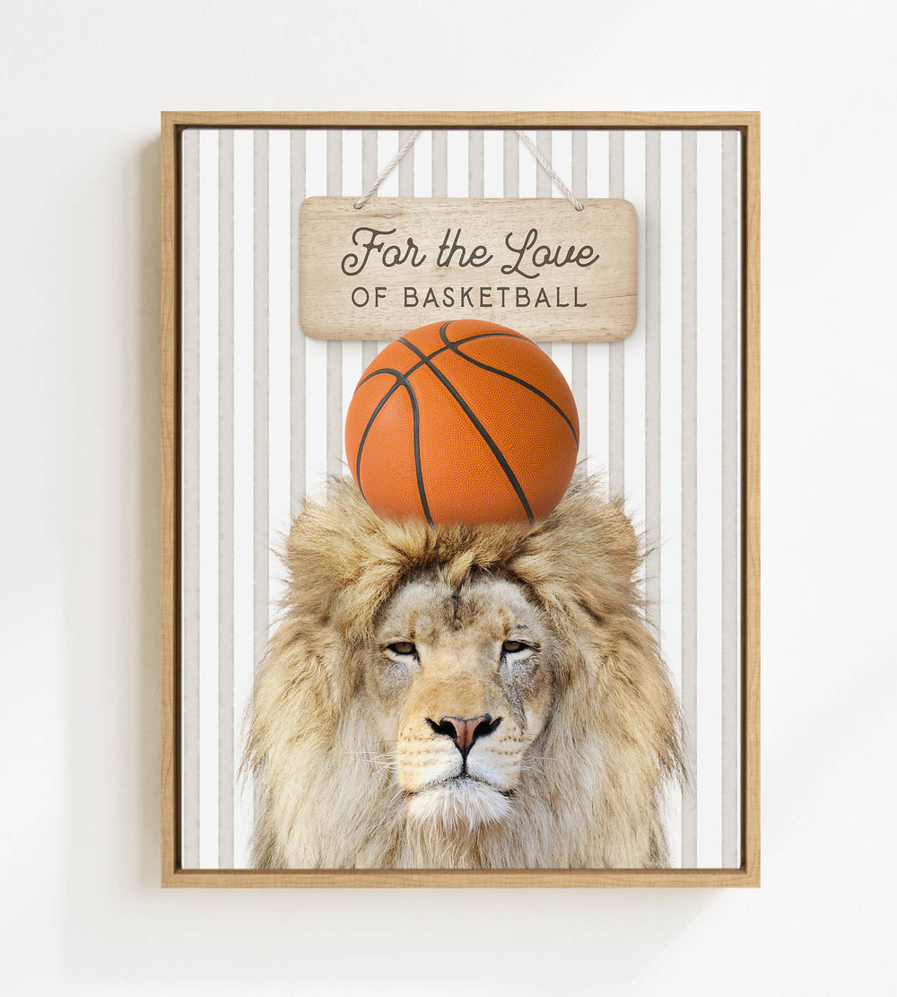 A framed image of a lion with a basketball on its head, accompanied by a wooden sign that reads "For the Love of Basketball".