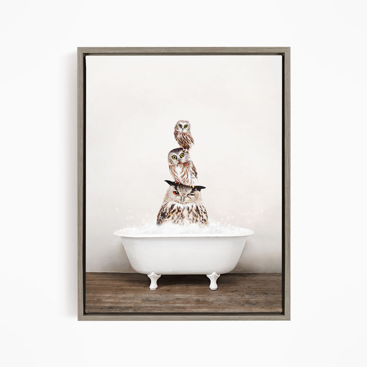 A framed image depicting three owls sitting in a white bathtub filled with water.