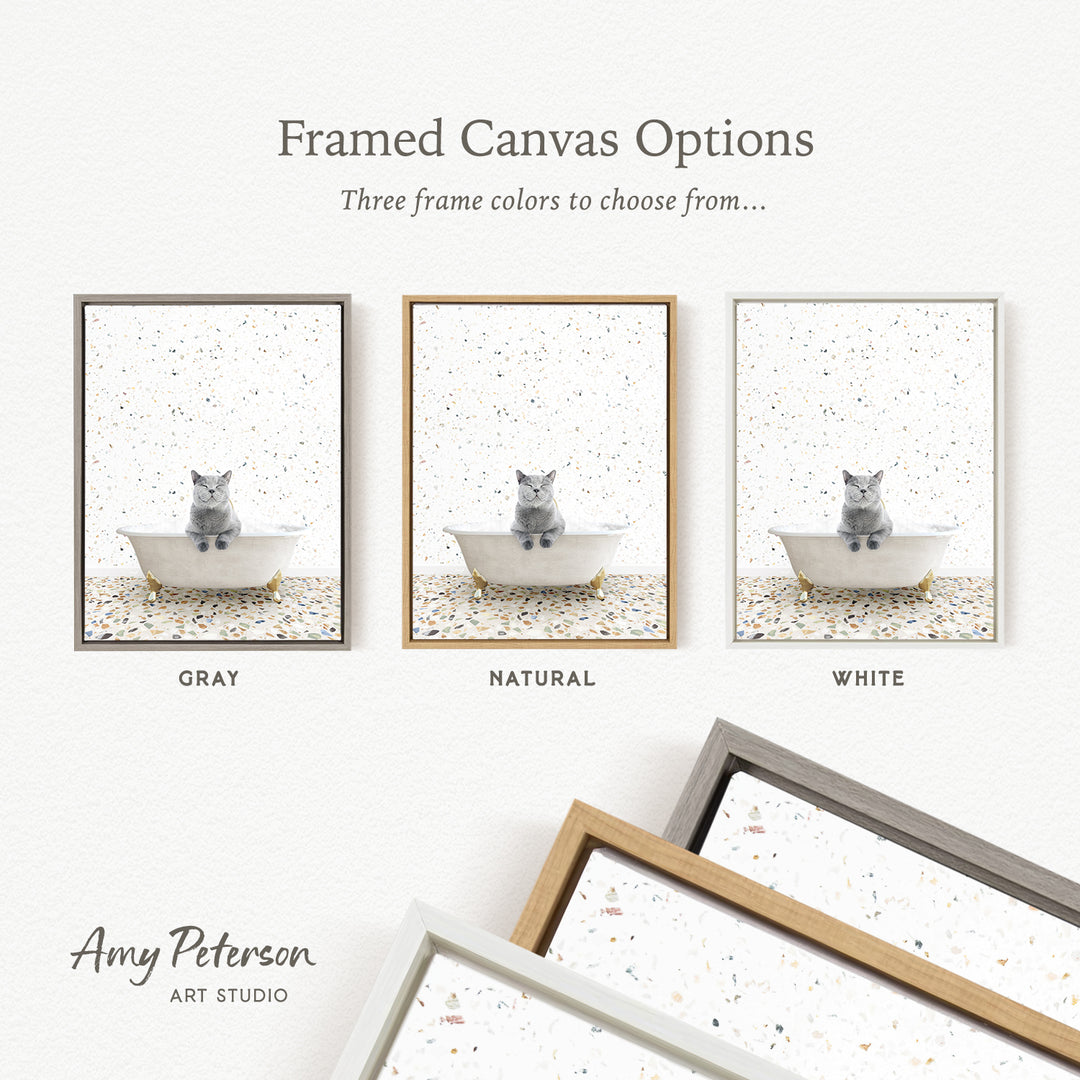 The image is a framed canvas option showcasing three different colored frames with a gray cat sitting in a bathtub.