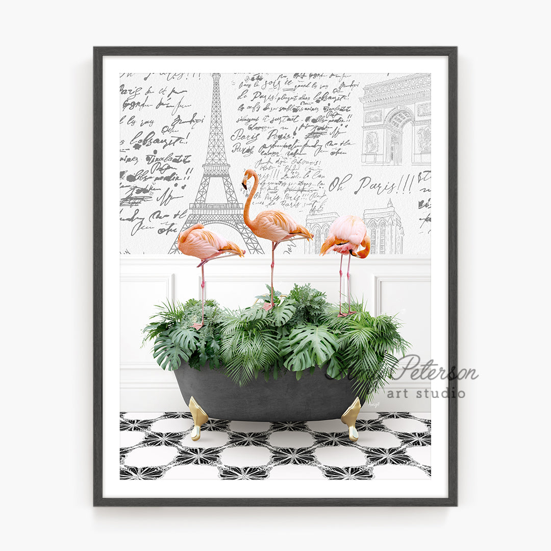 three pink flamingos in a planter on a black and white tile floor