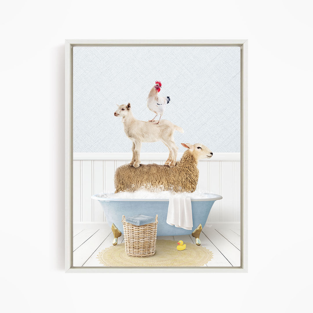 A framed image depicting a sheep standing on a cat's back while a chicken stands on the sheep's back, all in a bathtub filled with water and bubbles.