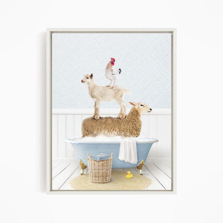 A framed image depicting a sheep standing on a cat's back while a chicken stands on the sheep's back, all in a bathtub filled with water and bubbles.