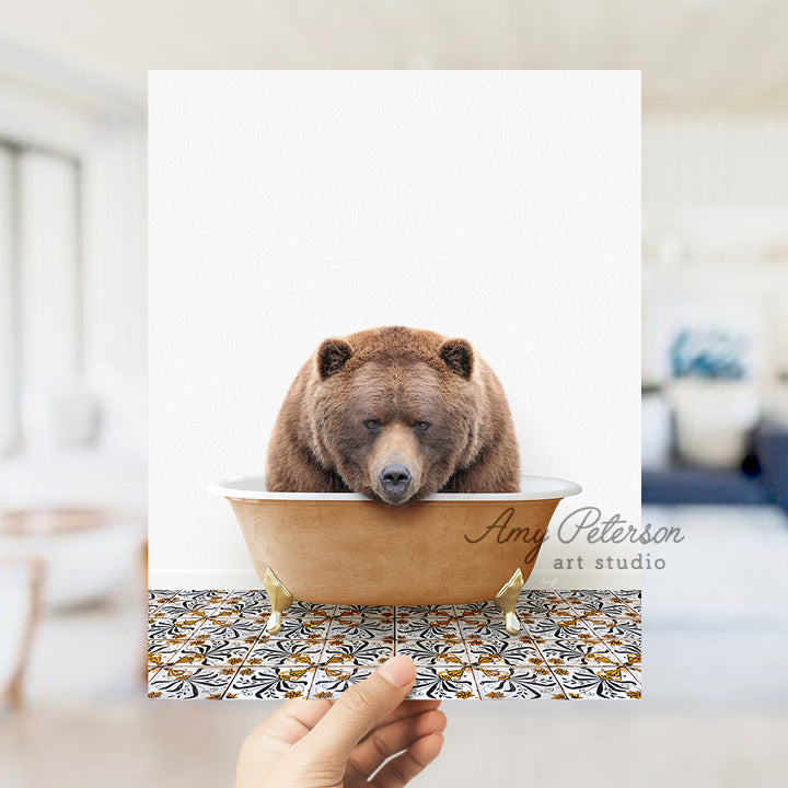 a person holding a card with a bear in a bathtub