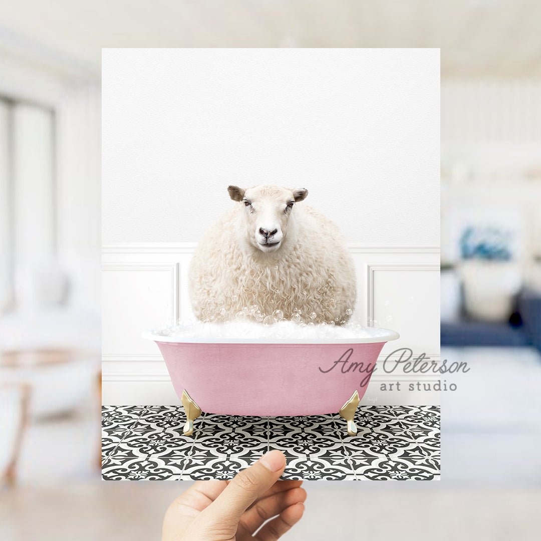 a sheep sitting in a pink bath tub