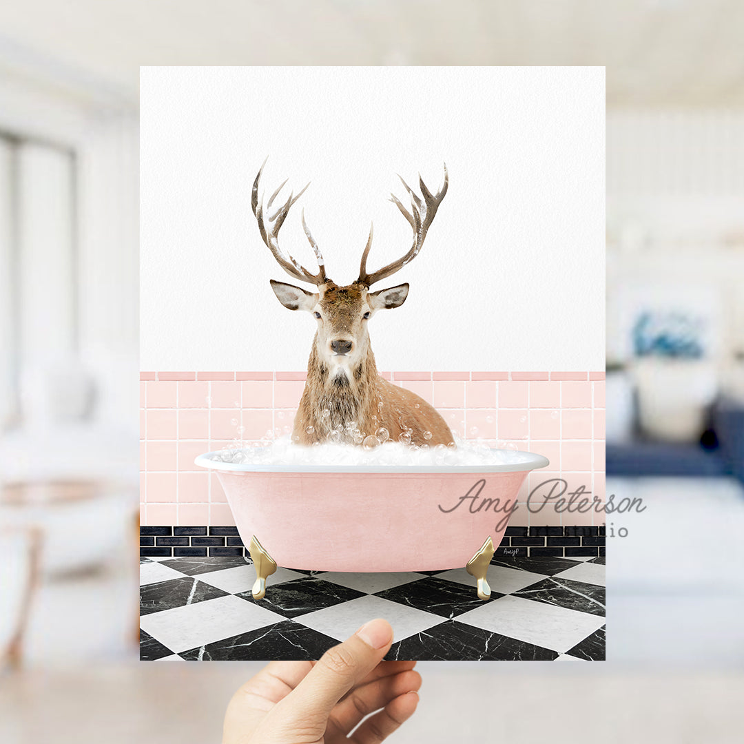 a person holding up a card with a picture of a deer in a bathtub