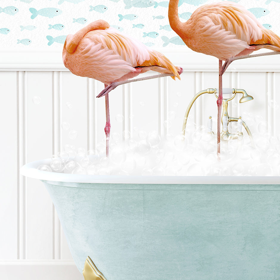 two pink flamingos standing in a bathtub filled with foam