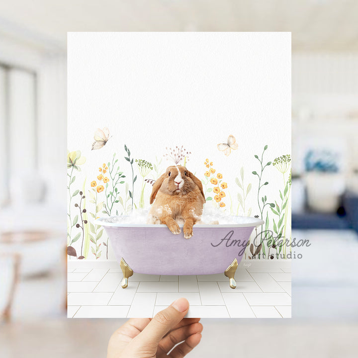 a person holding up a card with a picture of a rabbit in a bathtub