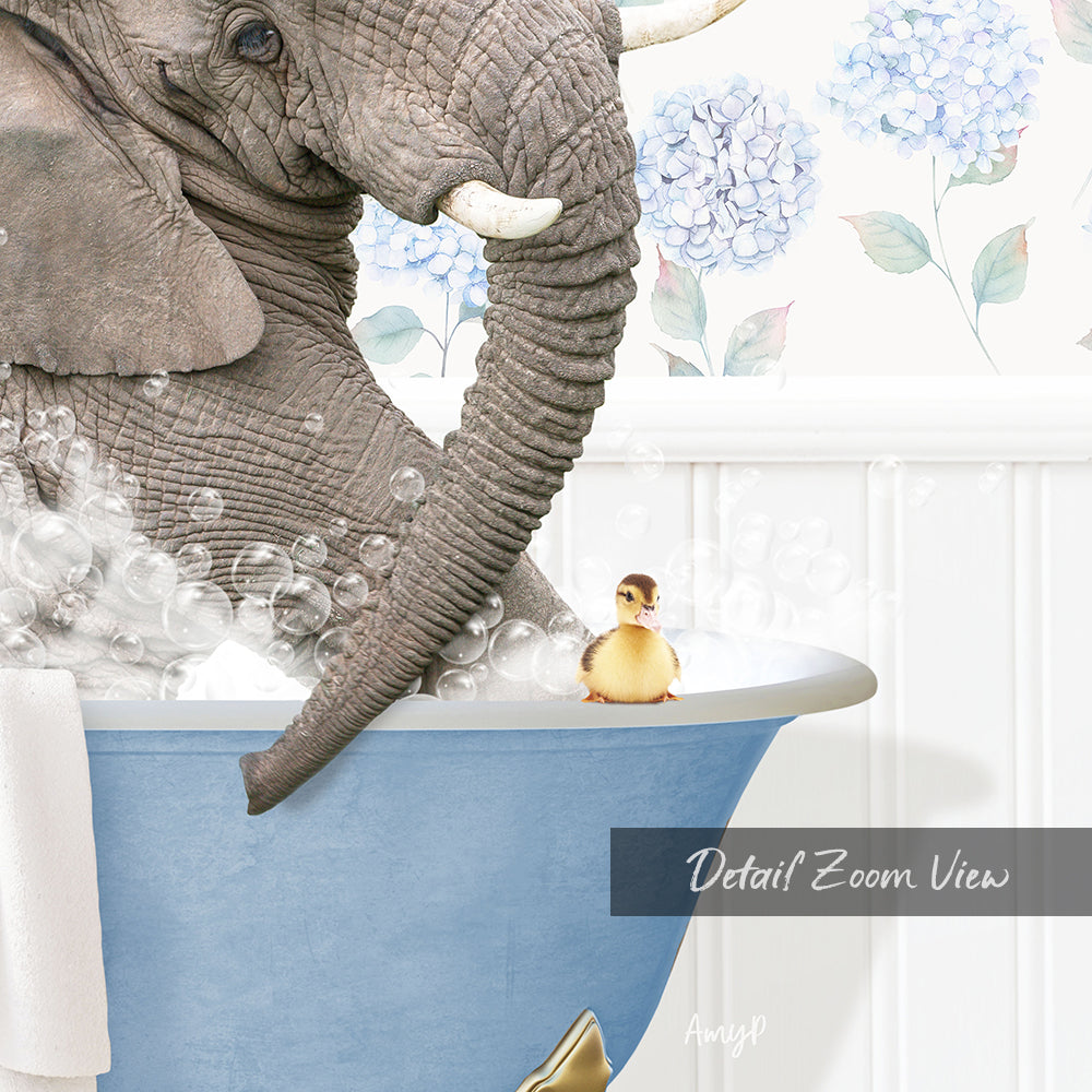 An elephant is taking a bath in a blue tub, with a small yellow duck sitting on the edge of the tub.