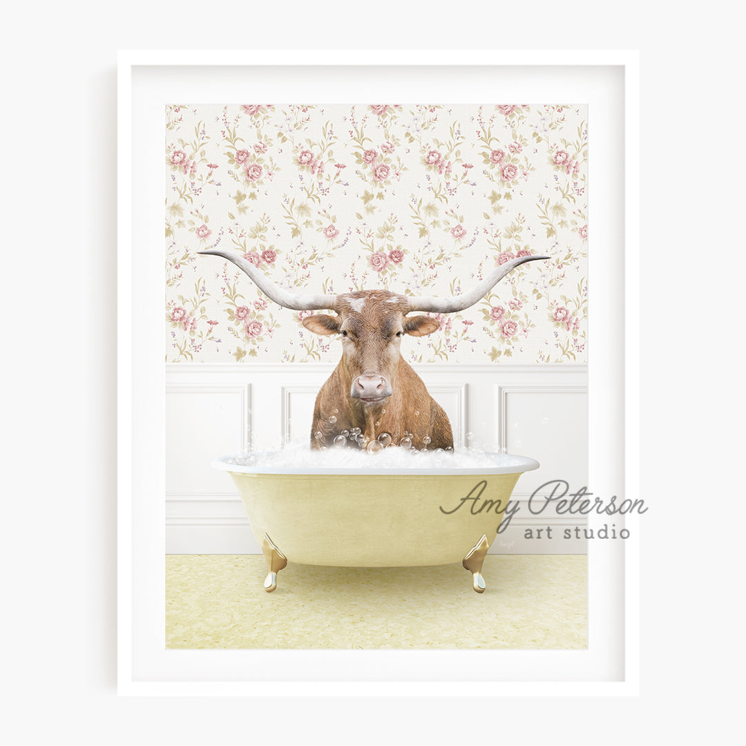 a long horn steer is sitting in a bathtub