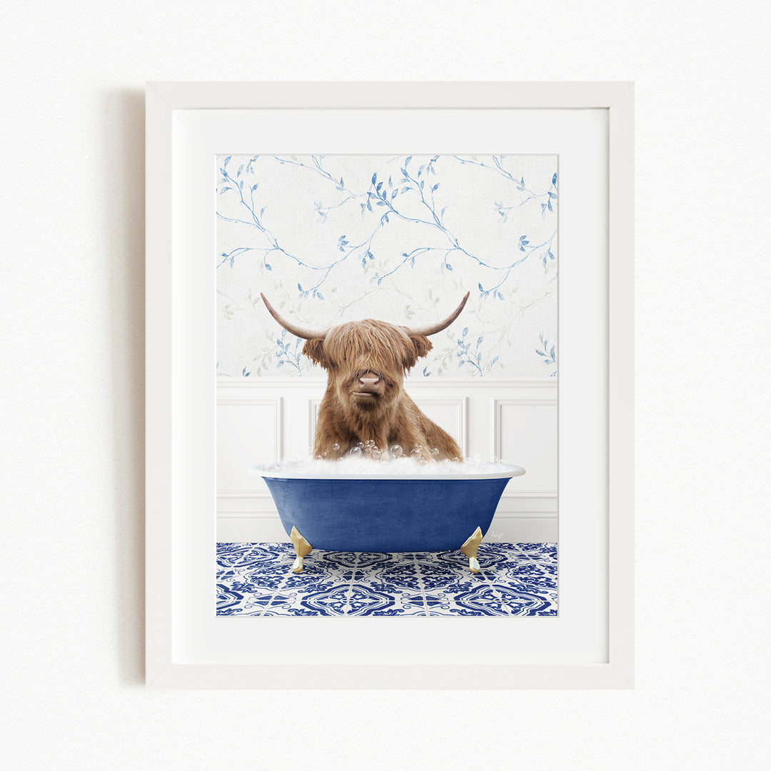 A brown cow with long horns is sitting in a blue bathtub, surrounded by a blue and white patterned floor.