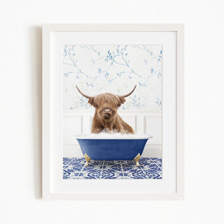 A brown cow with long horns is sitting in a blue bathtub, surrounded by a blue and white patterned floor.