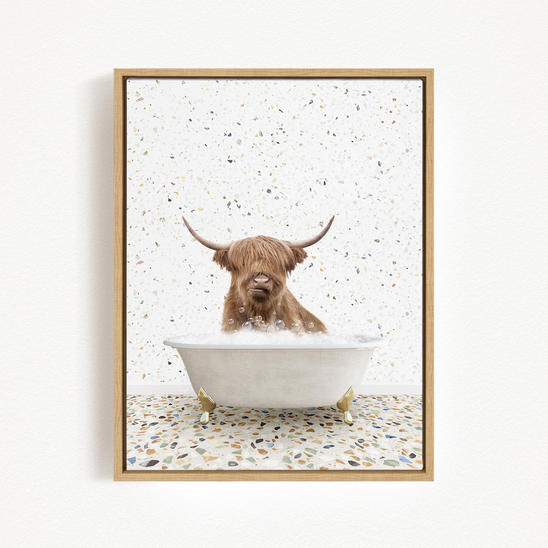 A brown cow with long horns is sitting in a white bathtub filled with water, surrounded by a speckled tiled floor.