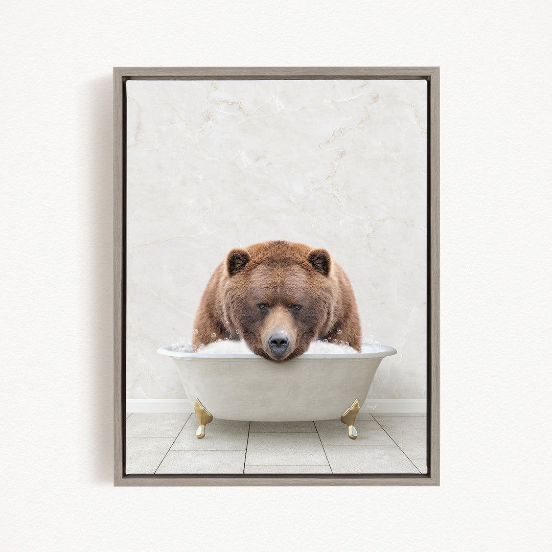 A brown bear is sitting in a white bathtub, appearing to be enjoying a relaxing bath.