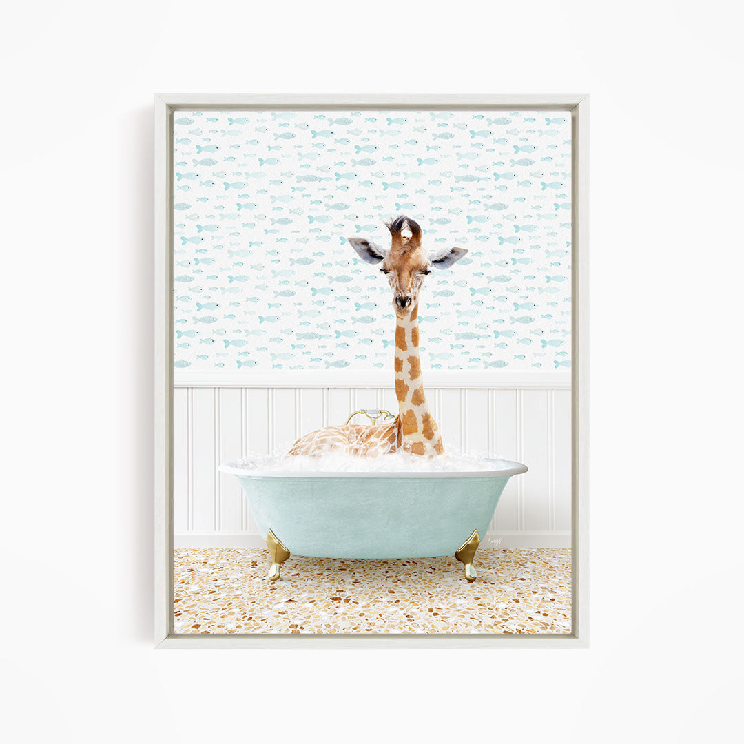 A giraffe is sitting in a light blue bathtub filled with water, surrounded by a pattern of small fish.