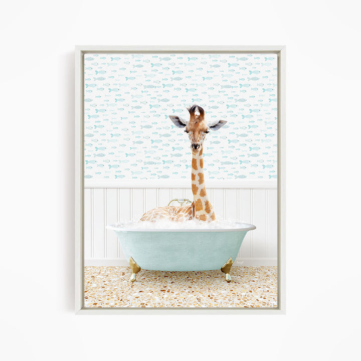 A giraffe is sitting in a light blue bathtub filled with water, surrounded by a pattern of small fish.