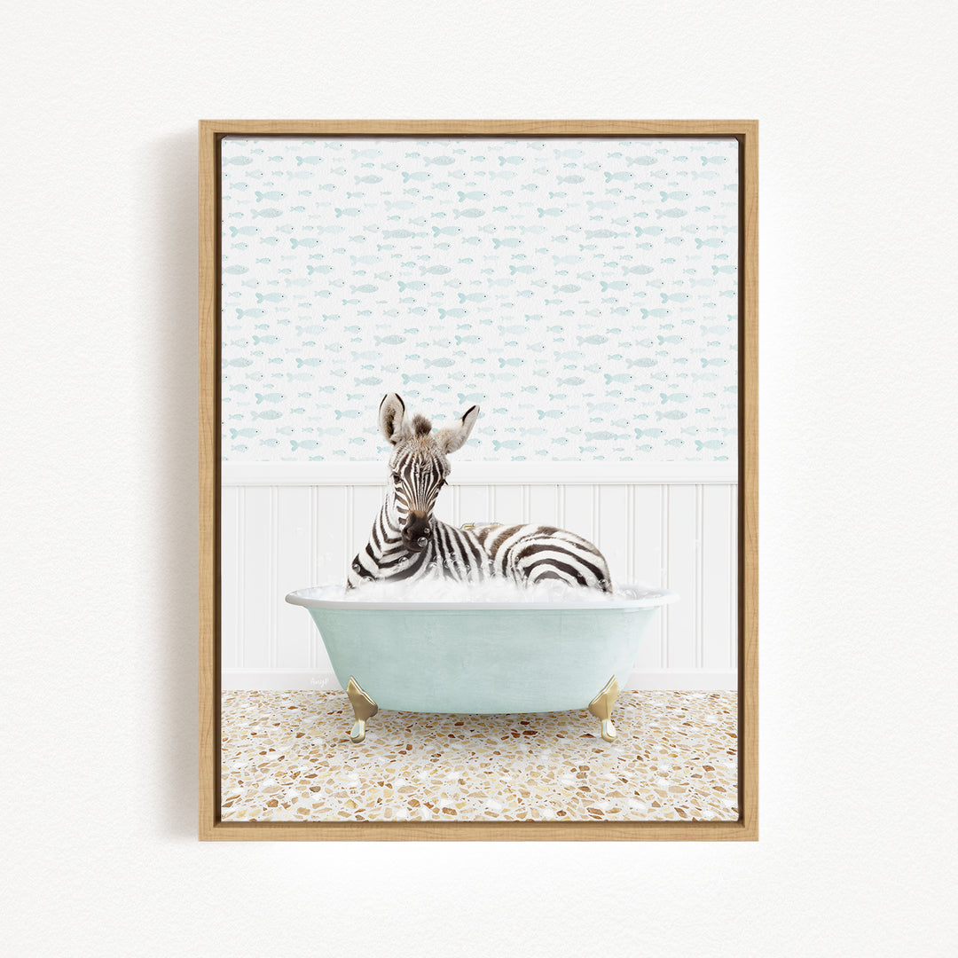 A zebra is sitting in a light blue bathtub, surrounded by a patterned tile floor and a white wall with a fish-themed wallpaper.