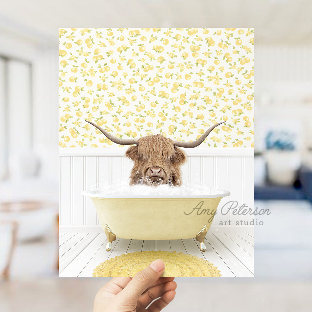 a person holding up a picture of a bull in a bathtub