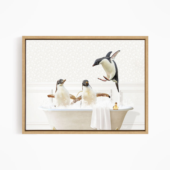 A framed image depicting three penguins sitting in a bathtub, with one penguin jumping out of the tub.