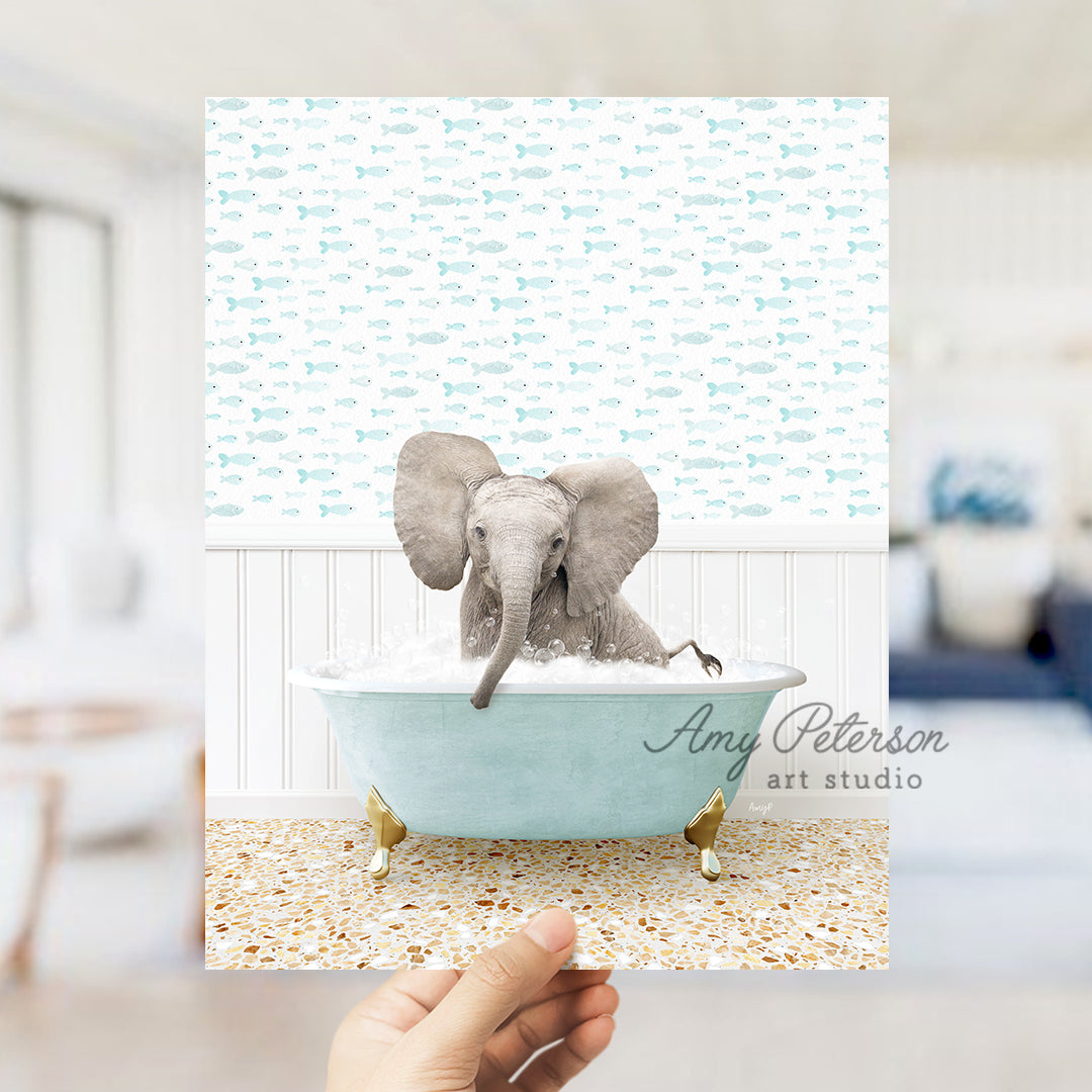 a person holding up a picture of an elephant in a bathtub