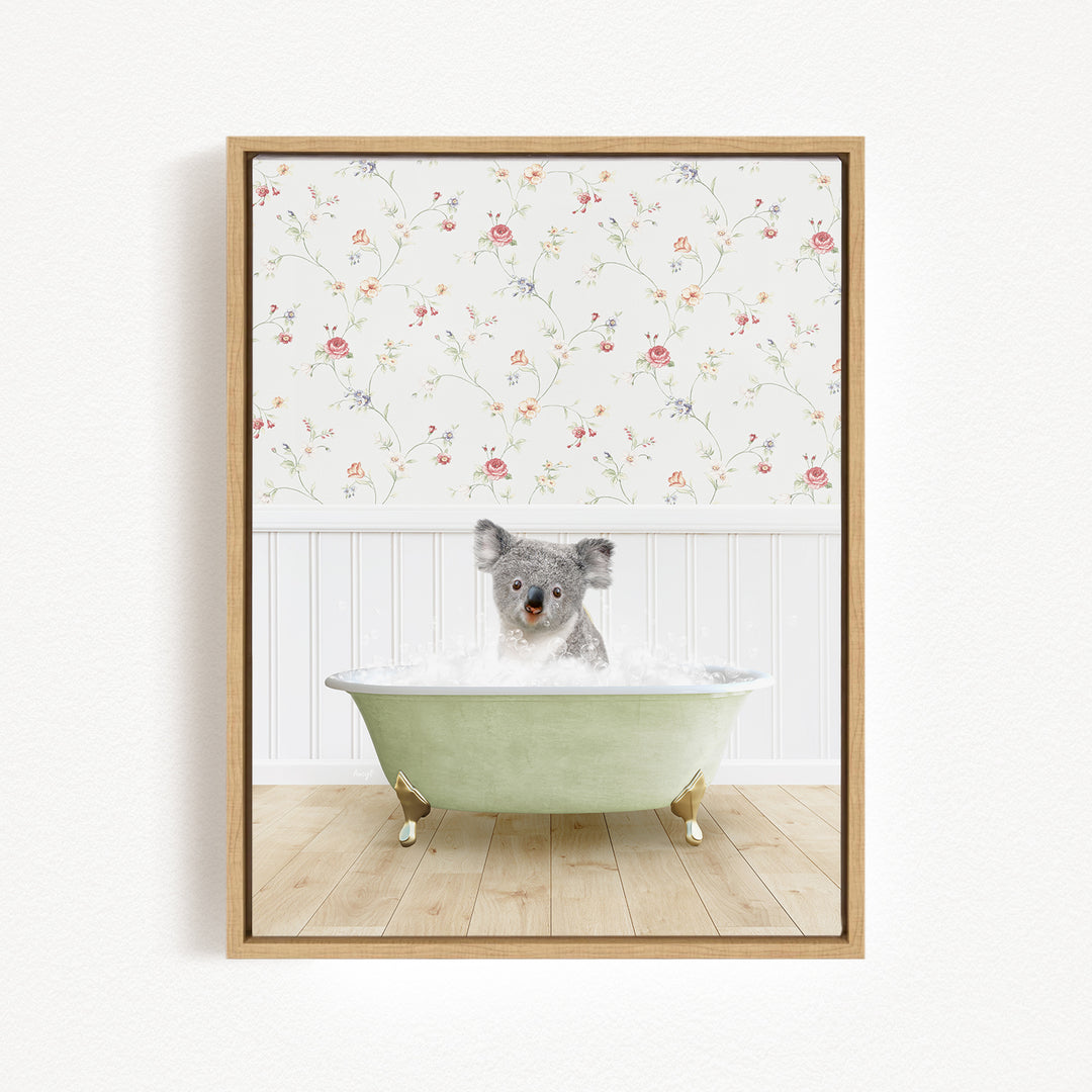 A koala bear sitting in a green bathtub filled with water, surrounded by a floral wallpaper.