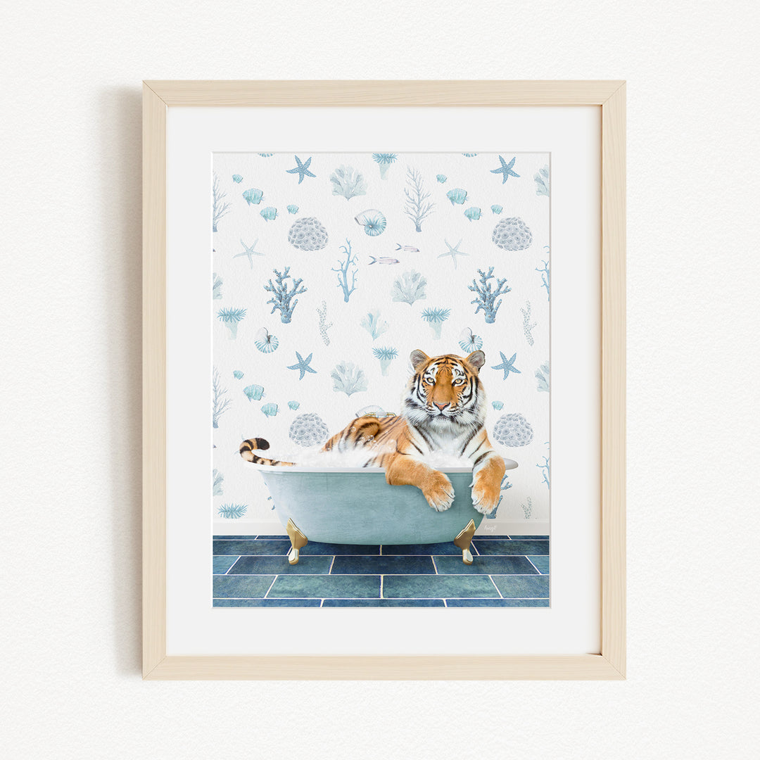 A tiger is sitting in a bathtub filled with water, surrounded by a blue and white patterned wall.