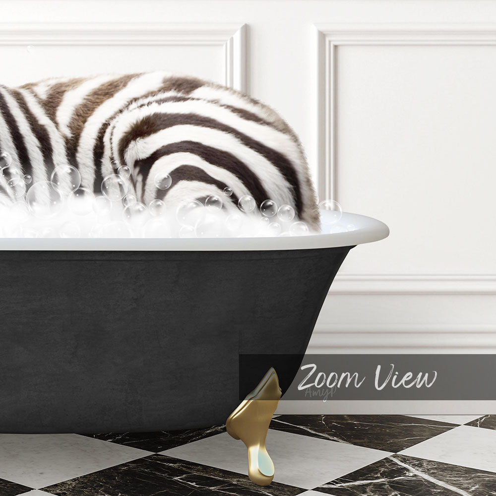 A zebra lying in a bathtub filled with bubbles, with a gold bathtub faucet visible.