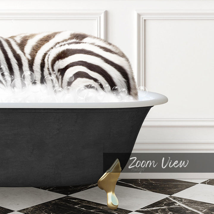 A zebra lying in a bathtub filled with bubbles, with a gold bathtub faucet visible.