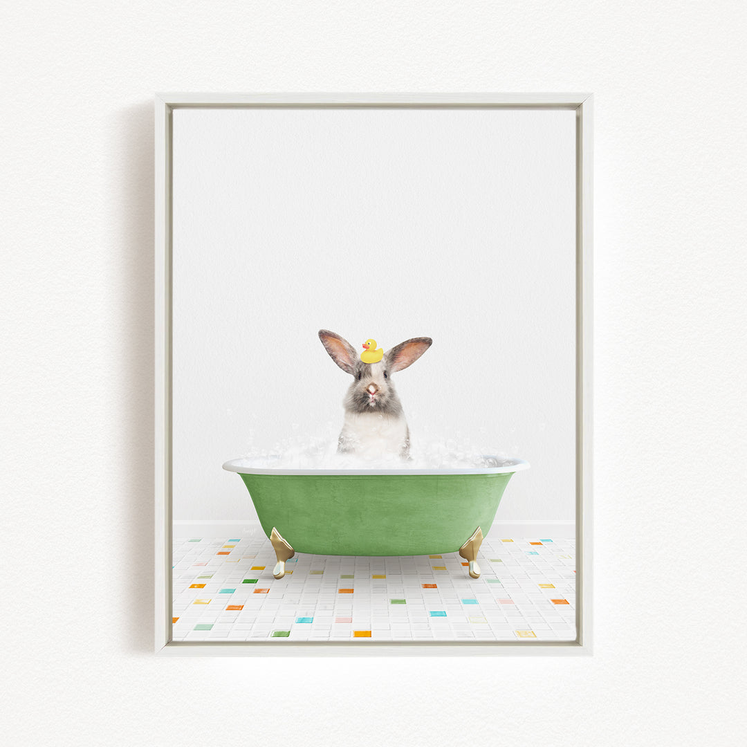 A rabbit sitting in a green bathtub filled with water, surrounded by colorful tiles on the floor.