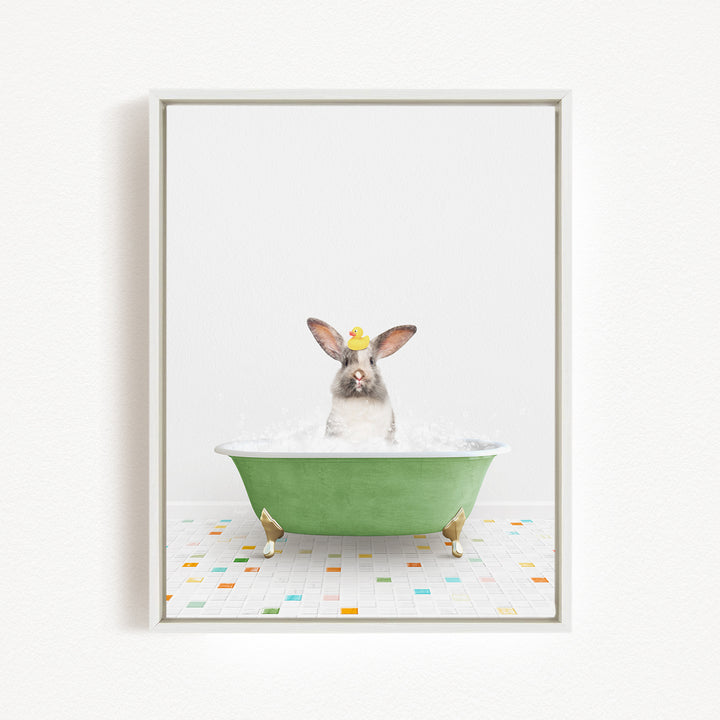 A rabbit sitting in a green bathtub filled with water, surrounded by colorful tiles on the floor.