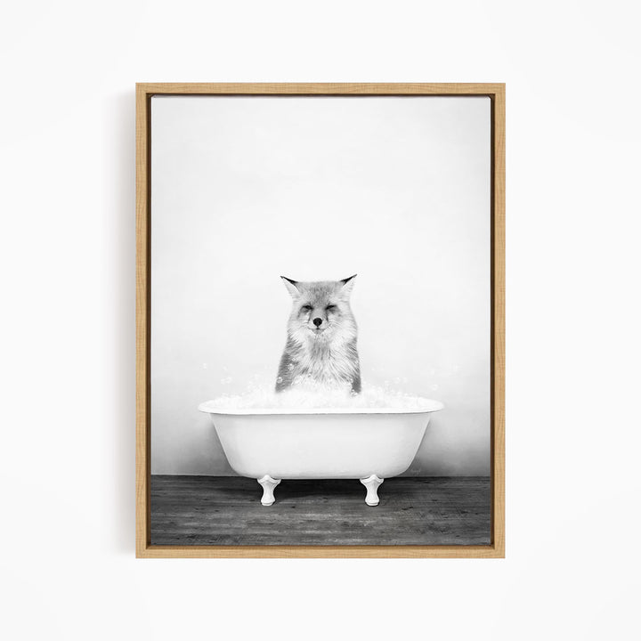 A cat sitting in a white bathtub filled with water, looking directly at the camera.