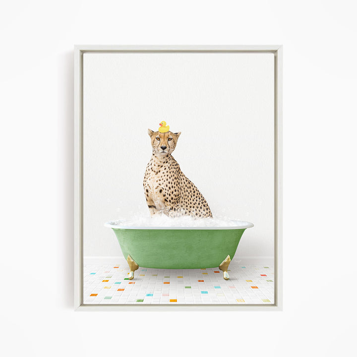 A cheetah sitting in a green bathtub filled with bubbles, wearing a yellow rubber duck hat.
