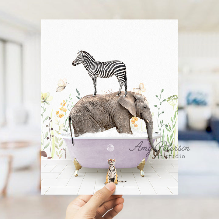 a person holding up a card with a picture of a zebra and an elephant on